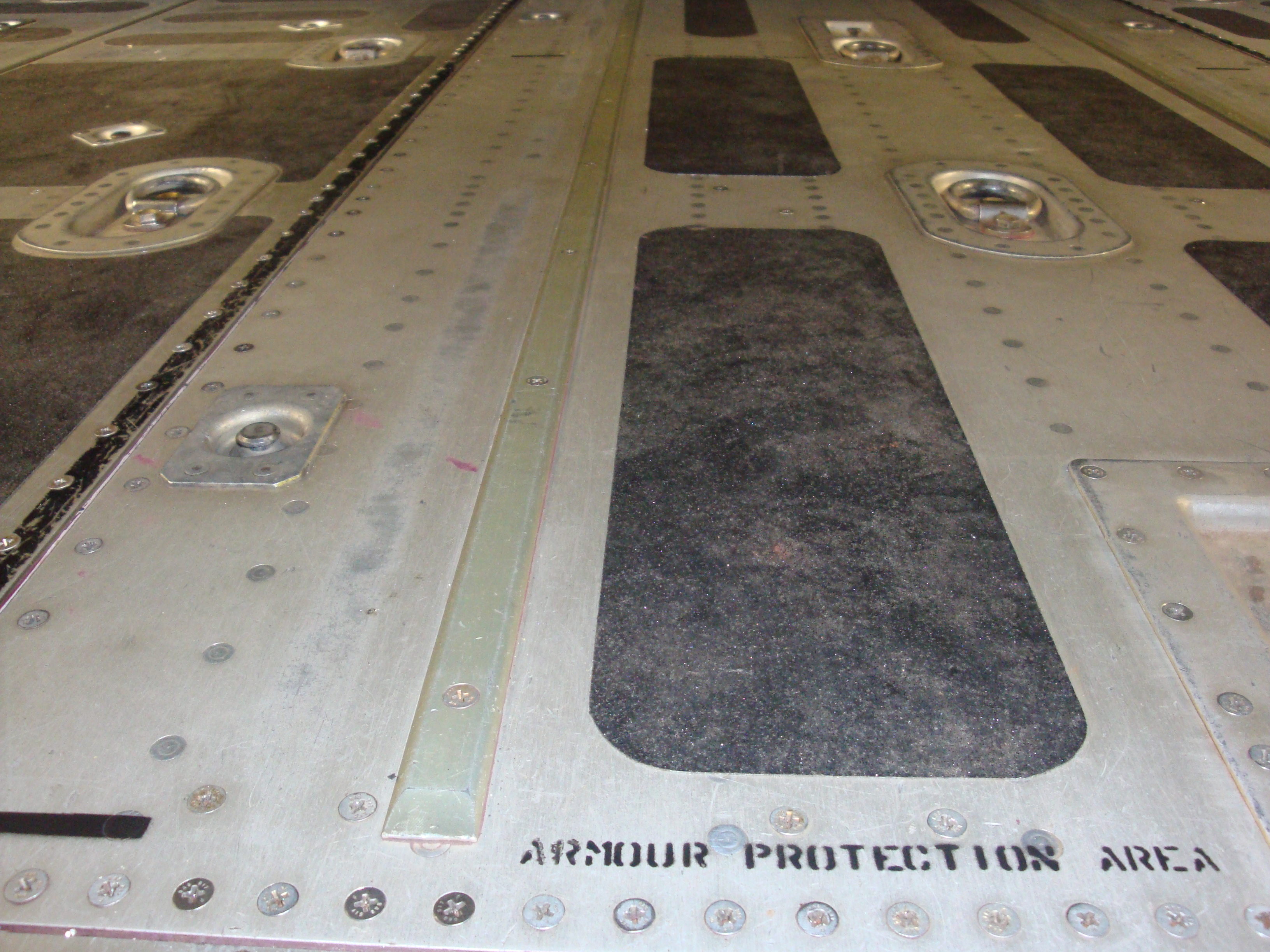 Underfloor ballistic armour floor panels with tactical NO STEP markings