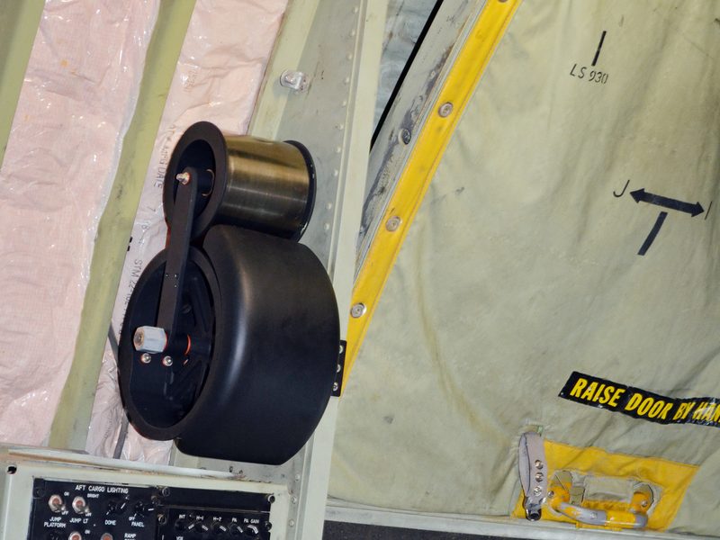 AMCE negator spring assembly installed on a C-130 paratroop door